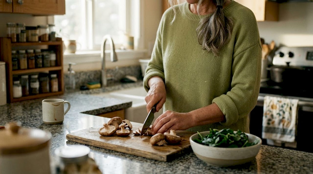 Woman preparing mushrooms in kitchen morning